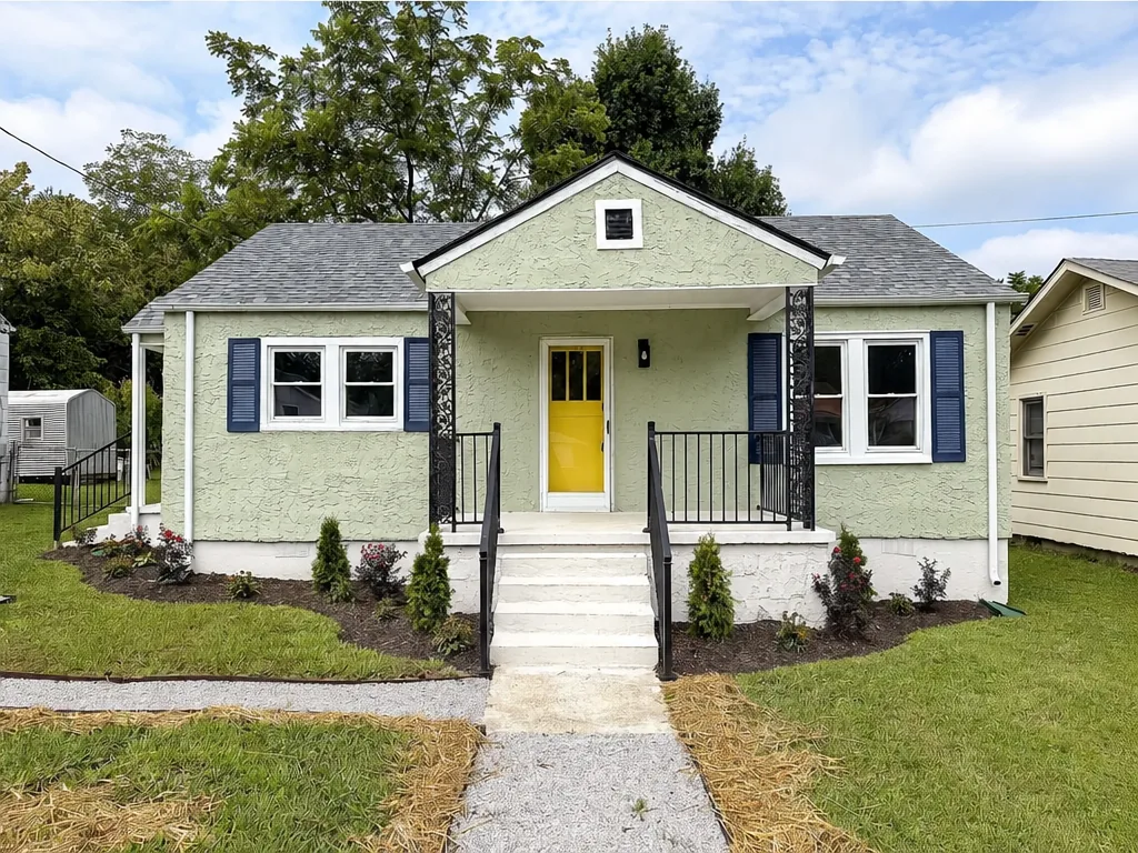 After: Fully renovated Rossville GA home with new roof, fresh exterior paint, rebuilt steps and landscaping